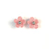 Pair of light pink crochet flower earrings on a white background