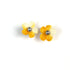 Pair of yellow crochet flower earrings on a white background