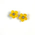 Pair of yellow crochet flower earrings on a white background